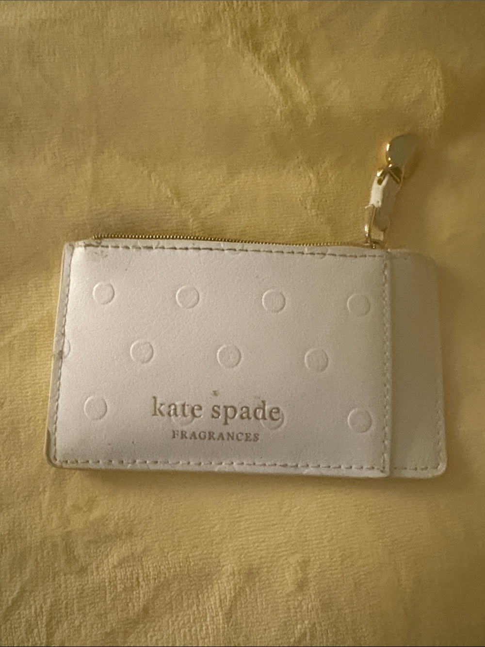 kate spade white embossed polka dot card pouch with gold zipper